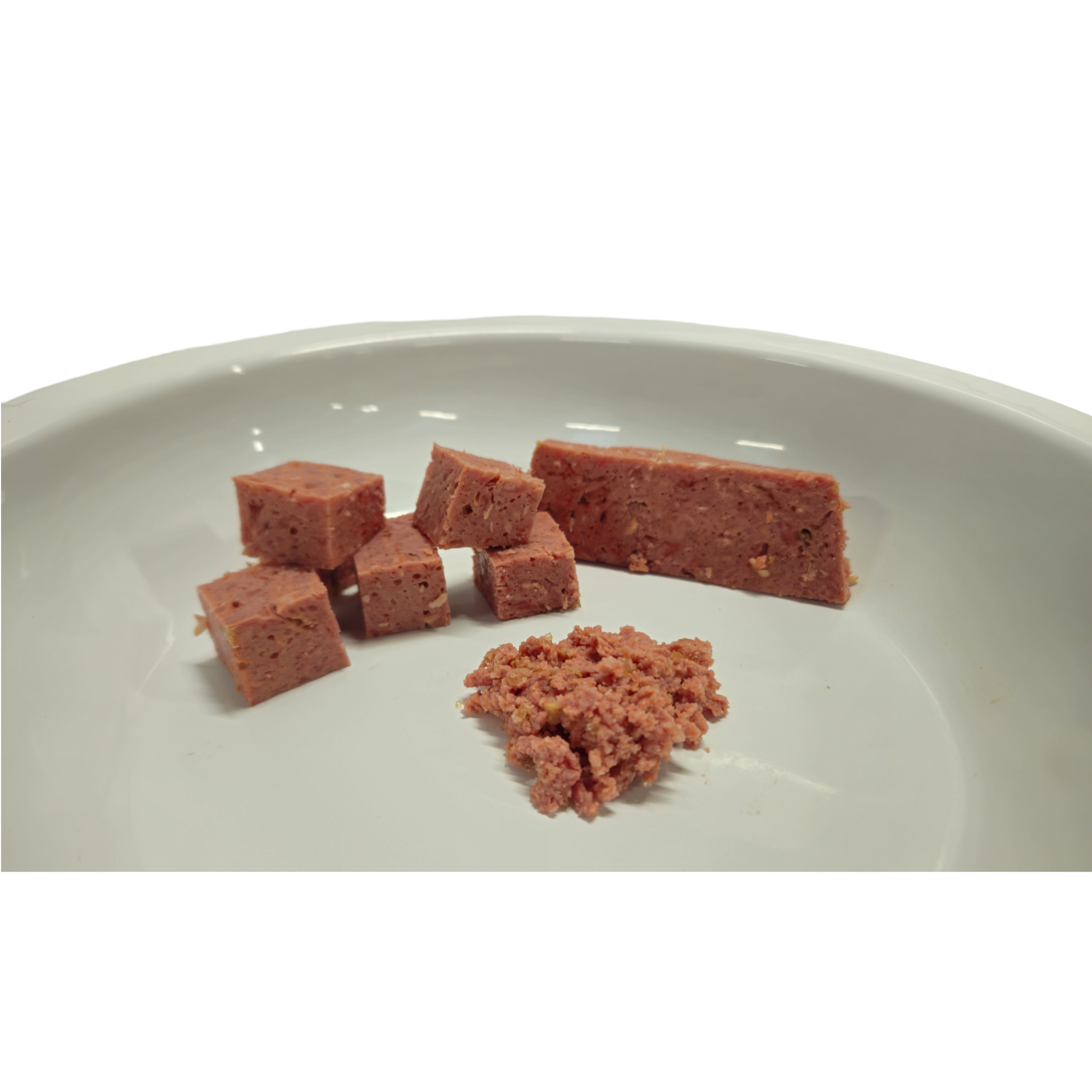 A prepared selection of optimal Performance 80-10-10 dog food cut into cubes, slices and mashed