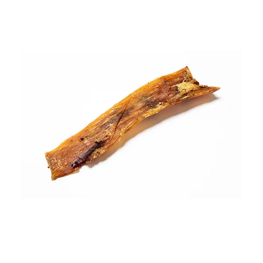 Dried paddywack for dogs on a white background